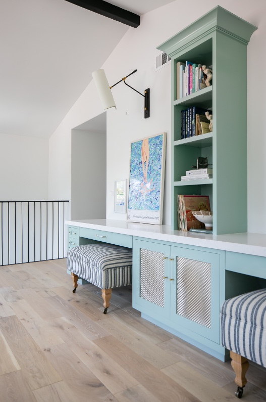 Upstairs study with seafoam built-in desk and bookcase