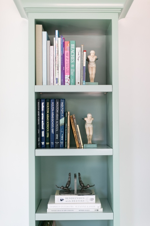 Seafoam bookcase styled with books and objects