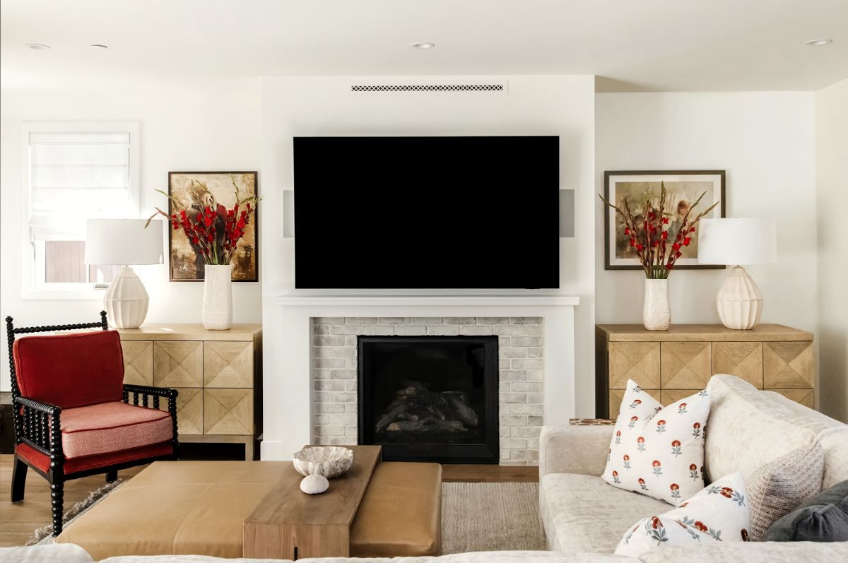 Family room with red lacquered armchair, leather ottoman and sectional